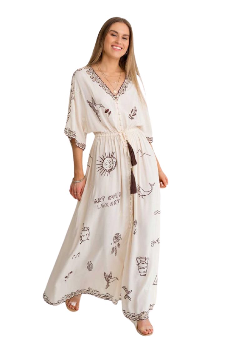 Woman wearing a long, patterned dress on a white background