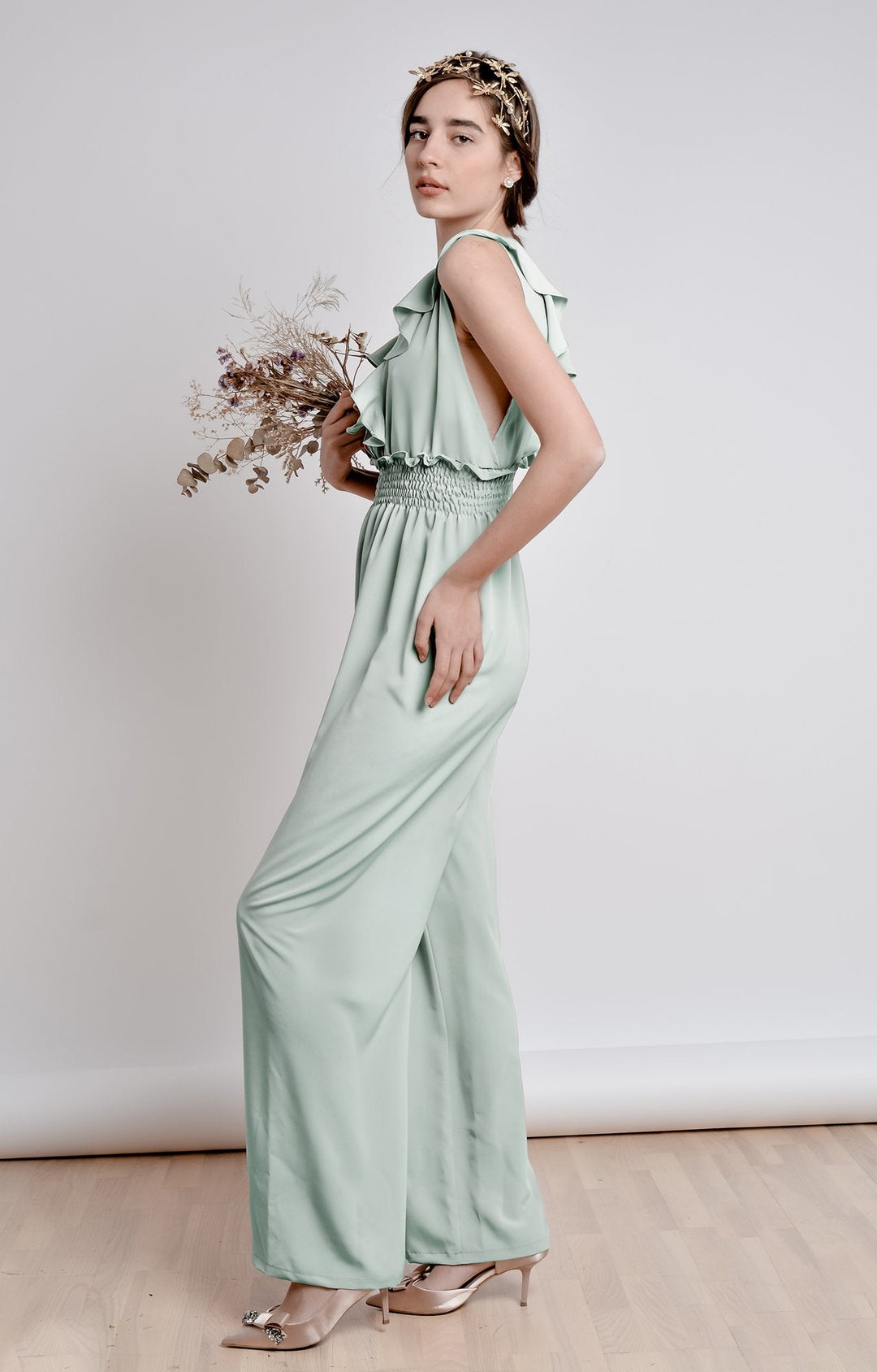 Mint green wide leg, sleeveless jumpsuit with ruffle and smocking details